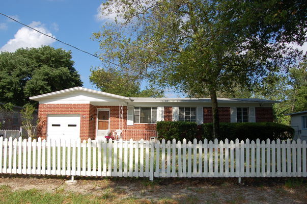 1920 Ector Road Jacksonville, FL 32211 - Photo 1 of 23 a front view of a house with a garden