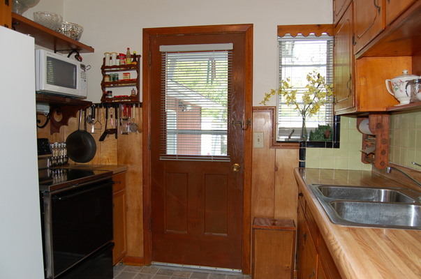1920 Ector Road Jacksonville, FL 32211 - Photo 11 of 23 a kitchen with a sink and a refrigerator