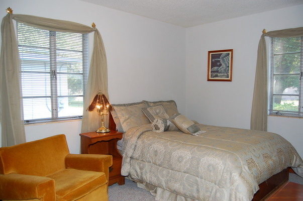 1920 Ector Road Jacksonville, FL 32211 - Photo 16 of 23 a bedroom with bed couch and window