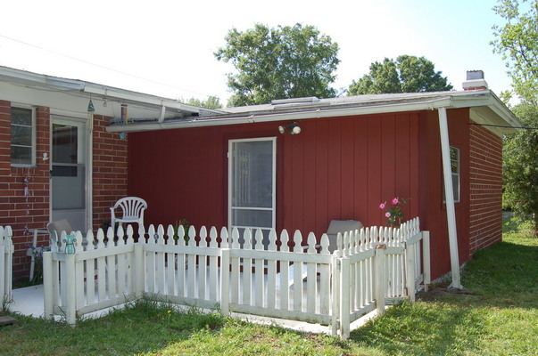 1920 Ector Road Jacksonville, FL 32211 - Photo 18 of 23 a view of a house with a small yard and wooden fence