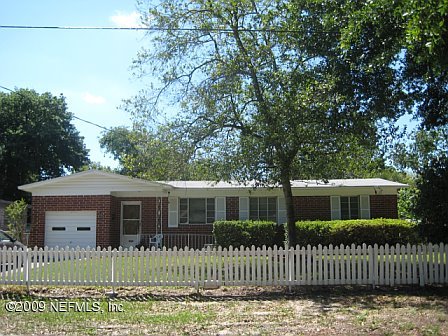 1920 Ector Road Jacksonville, FL 32211 - Photo 4 of 23 a front view of a house with a garden