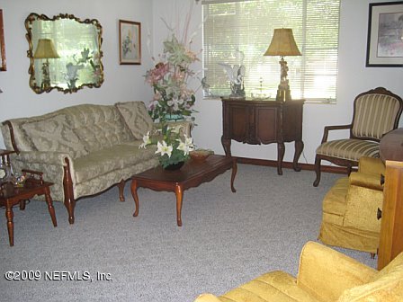 1920 Ector Road Jacksonville, FL 32211 - Photo 9 of 23 a living room with furniture and a window