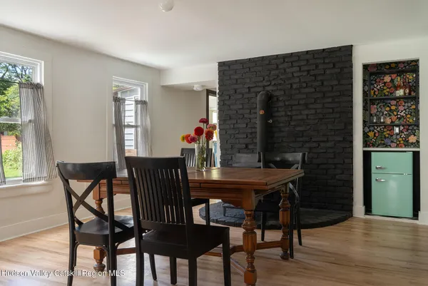 a view of a dining room with furniture and wooden floor