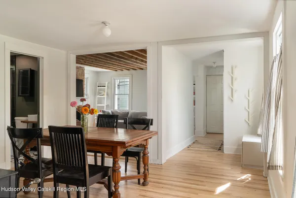 a dining room with furniture and window