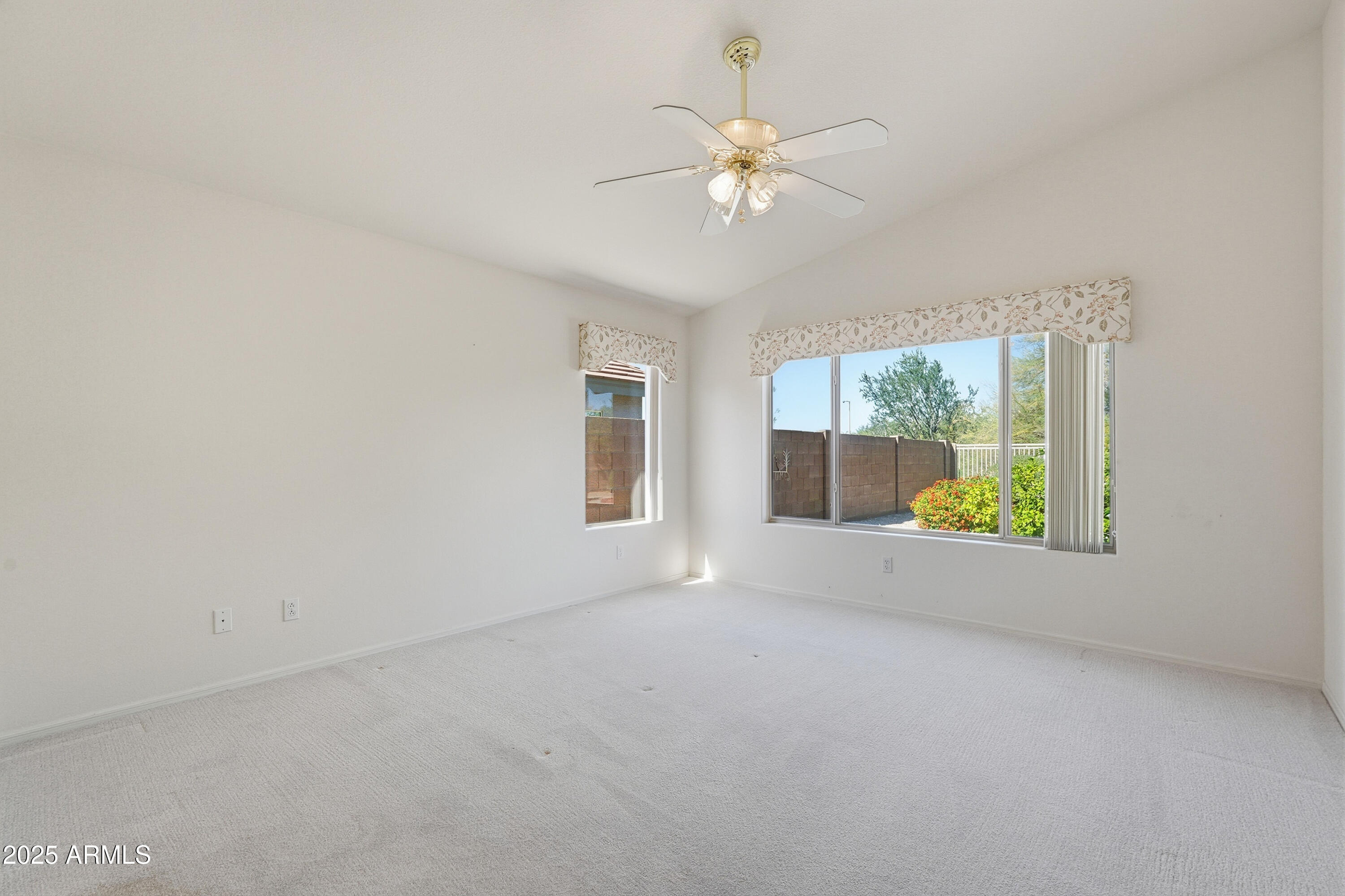4626 East Thorn Tree Drive Cave Creek, AZ 85331 - Photo 14 of 30 an empty room with windows and fan
