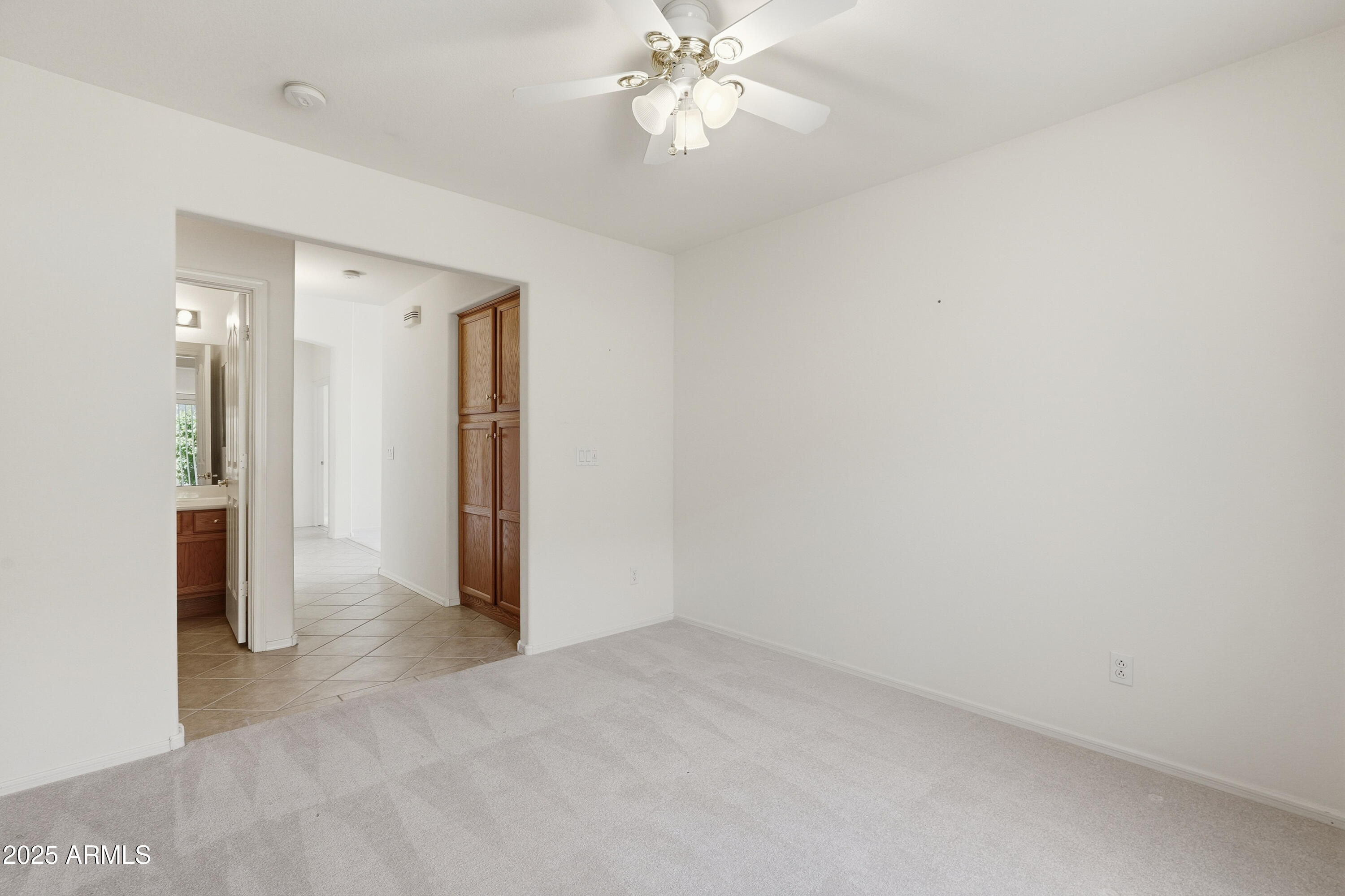 4626 East Thorn Tree Drive Cave Creek, AZ 85331 - Photo 19 of 30 an empty room with fan and entrance