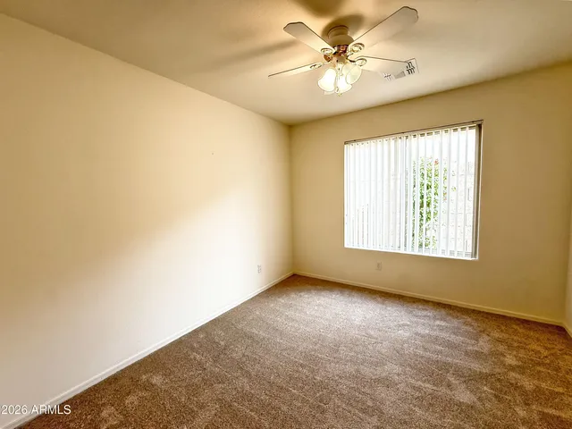 a view of a house with snow on the road