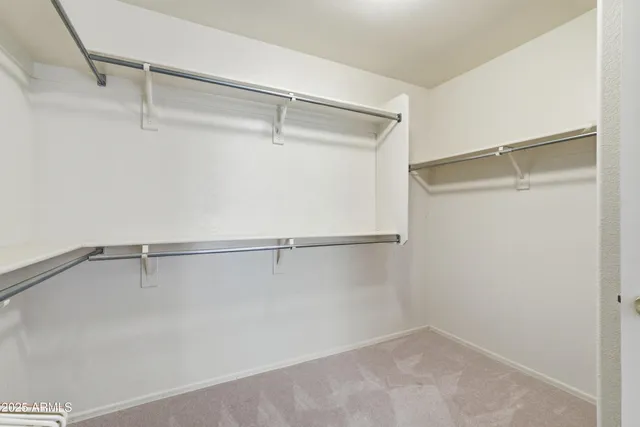 a bathroom with a double vanity sink a mirror and a bathtub