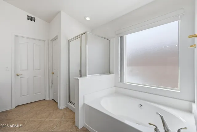 a bathroom with a granite countertop sink mirror and double