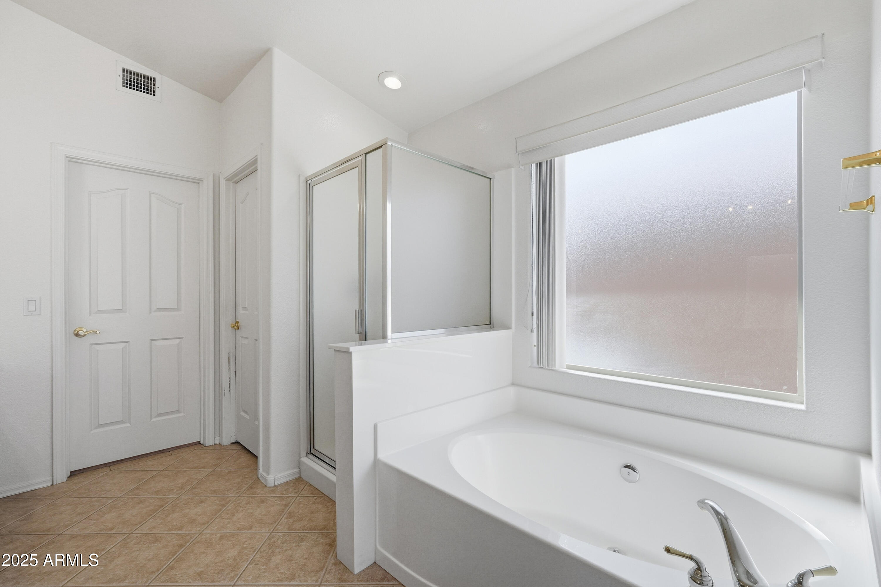 4626 East Thorn Tree Drive Cave Creek, AZ 85331 - Photo 24 of 30 a bathroom with a bathtub and a shower