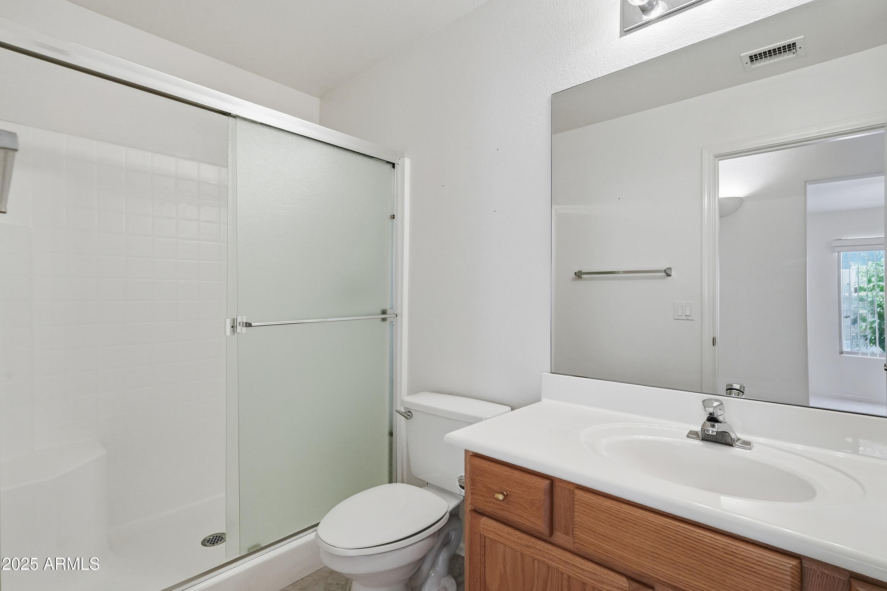 4626 East Thorn Tree Drive Cave Creek, AZ 85331 - Photo 26 of 30 a bathroom with a sink a toilet and shower