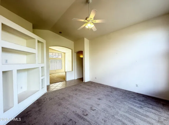 a kitchen with stainless steel appliances granite countertop a refrigerator stove top oven and sink