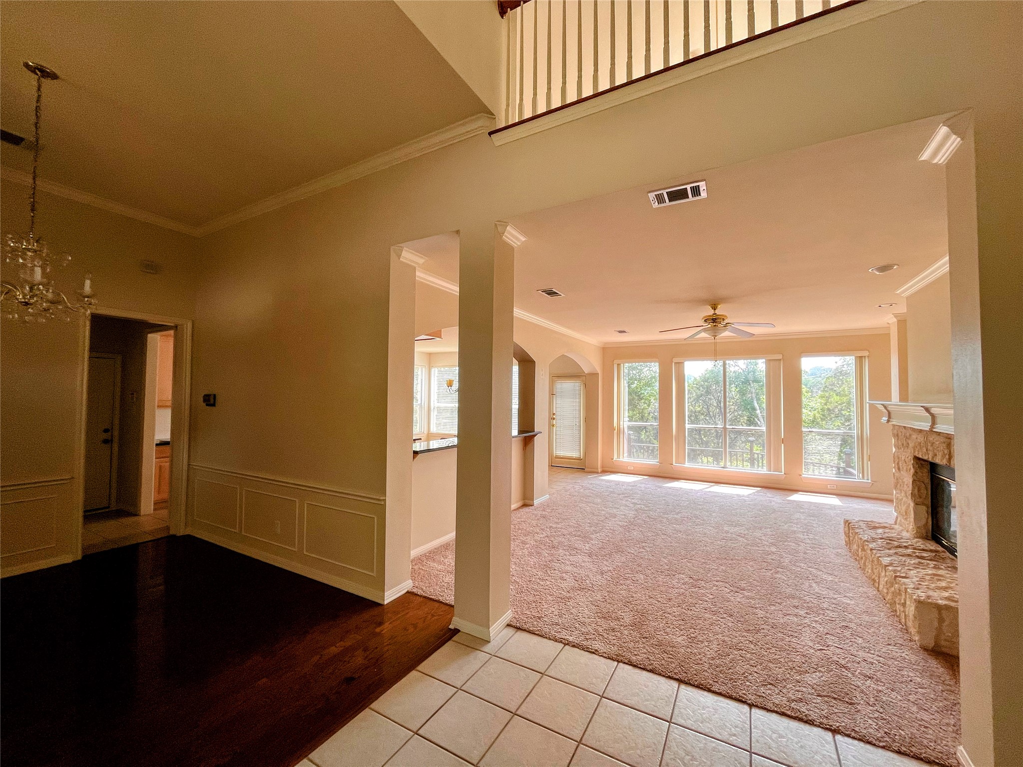 9405 Ashton Ridge Austin, TX 78750 - Photo 6 of 22 Natural light floods this inviting living space, complete with a cozy stone fireplace.