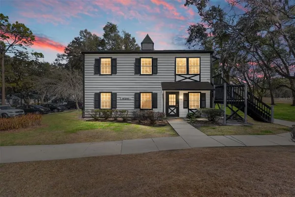 a front view of house with yard and green space