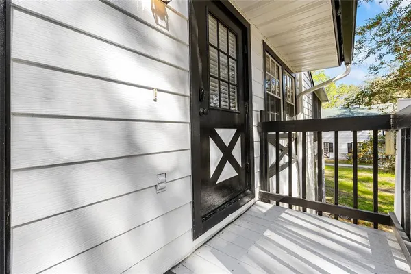 a view of a balcony with wooden floor