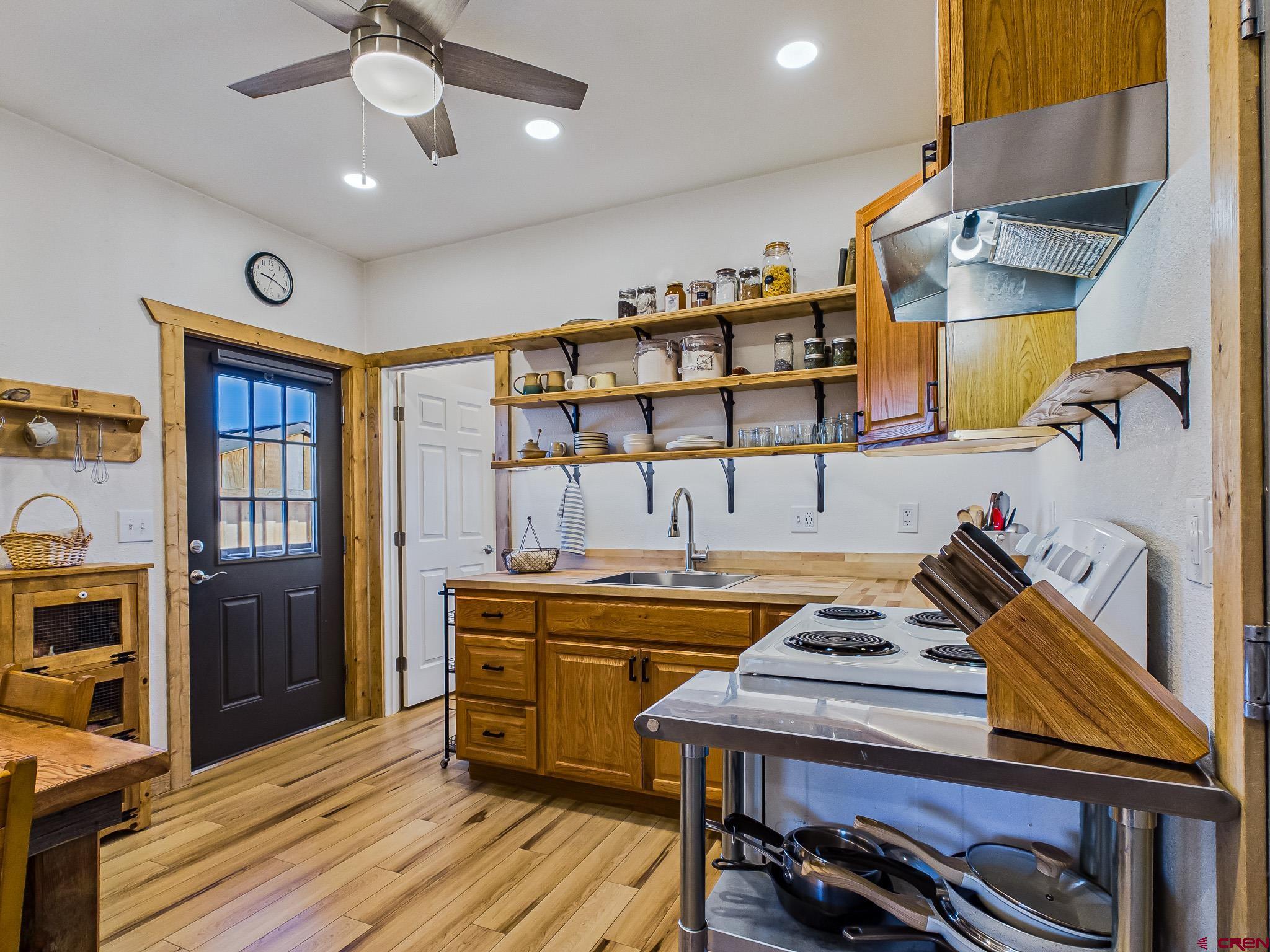 75707 B76 Road Crawford, CO 81415 - Photo 17 of 45 a open kitchen with stainless steel appliances granite countertop a stove and a refrigerator