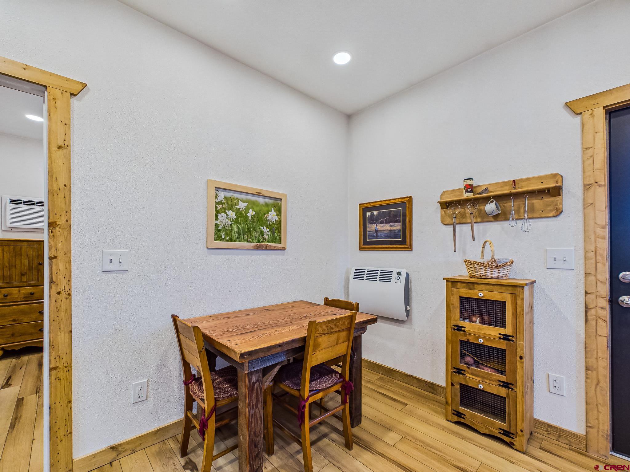 75707 B76 Road Crawford, CO 81415 - Photo 19 of 45 a view of a dining room with furniture and wooden floor