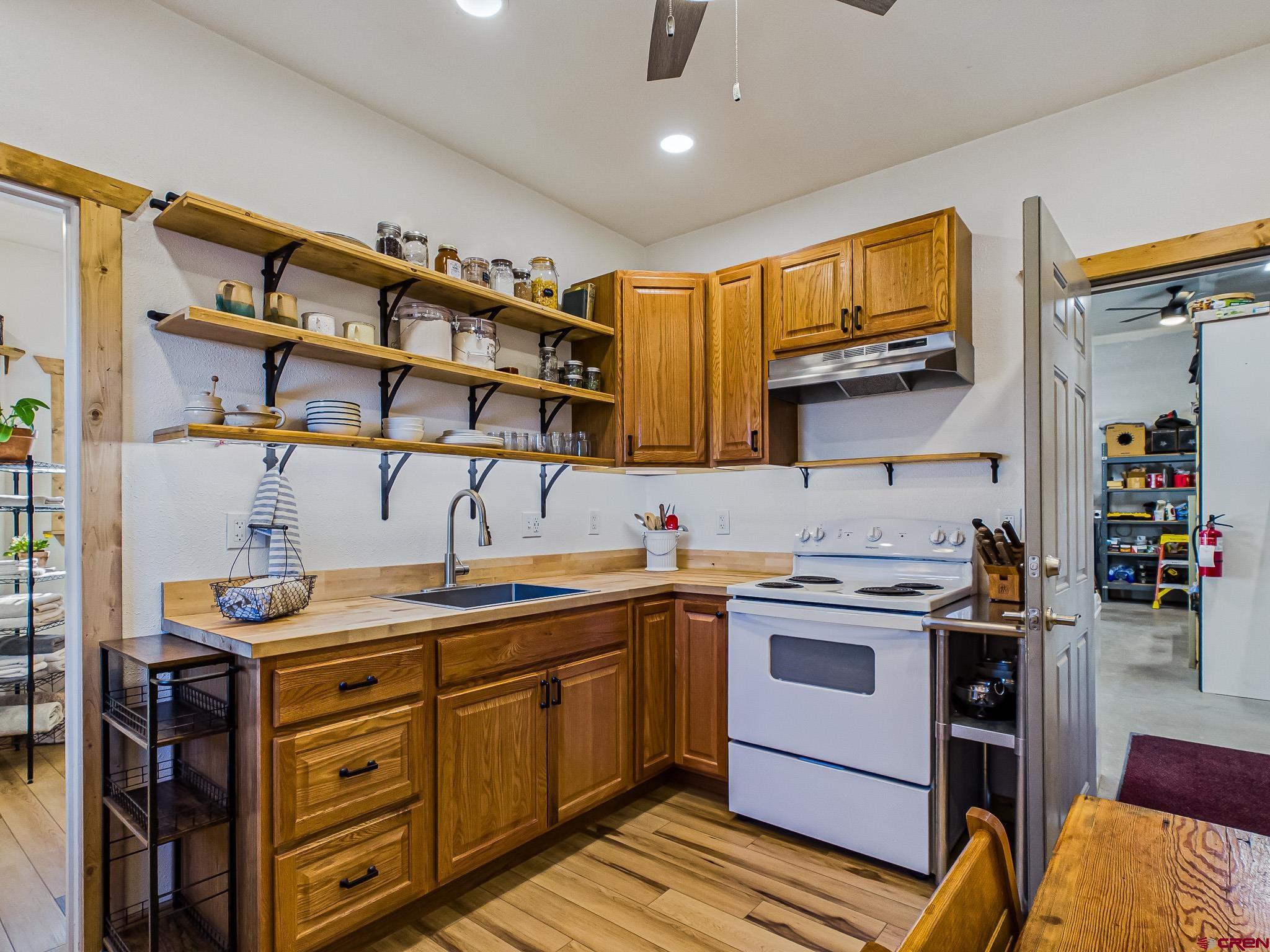 75707 B76 Road Crawford, CO 81415 - Photo 20 of 45 a kitchen with a sink stove and cabinets