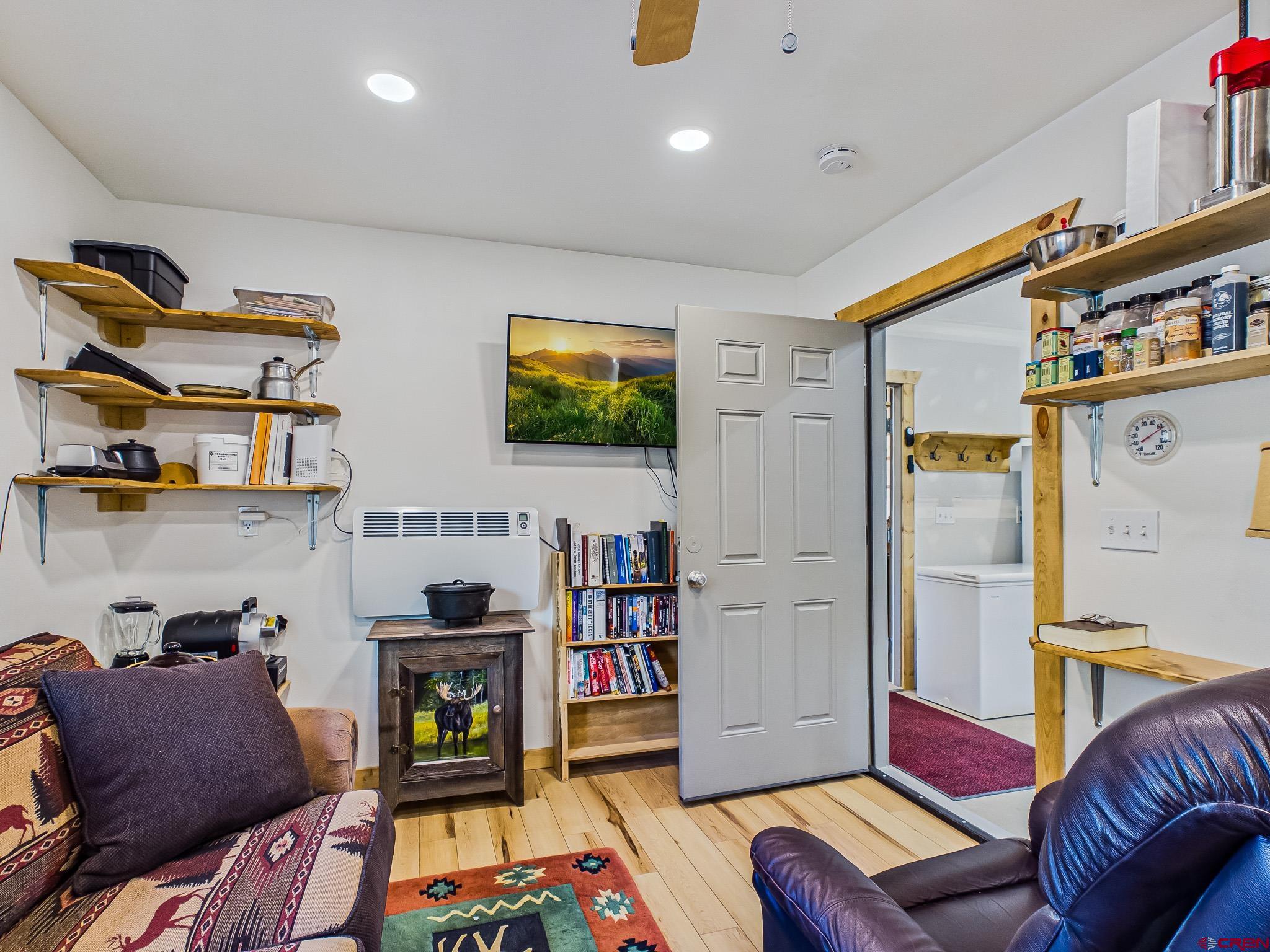 75707 B76 Road Crawford, CO 81415 - Photo 24 of 45 a living room with furniture and a flat screen tv