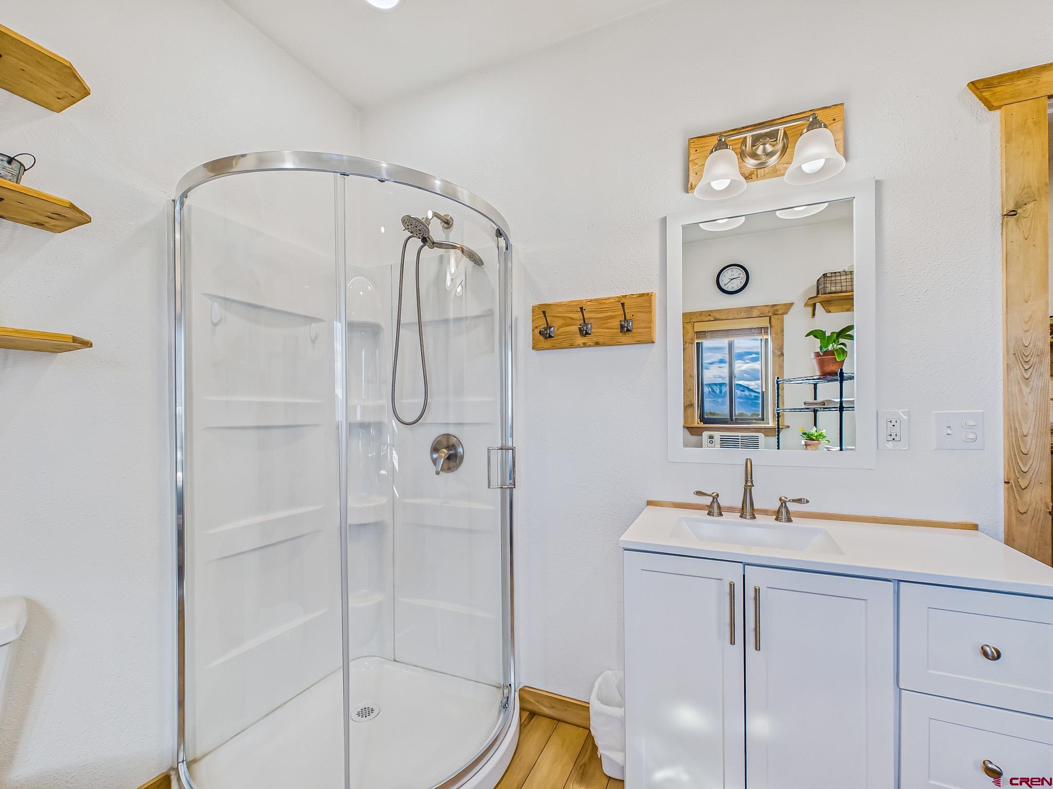 75707 B76 Road Crawford, CO 81415 - Photo 29 of 45 a bathroom with a sink a mirror and a shower