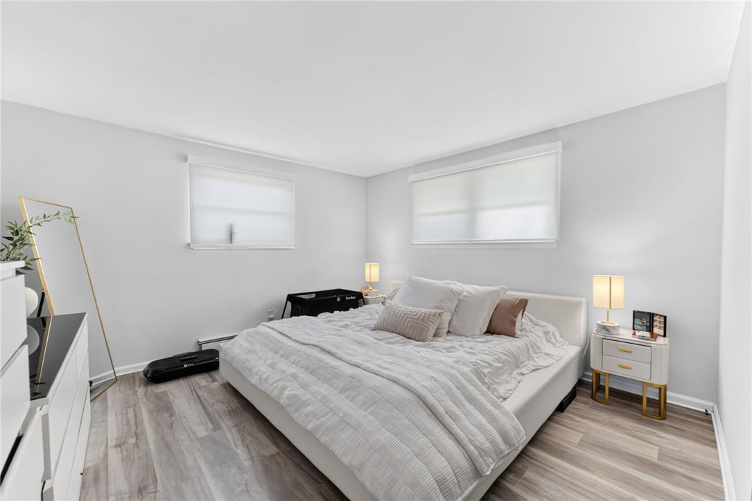 7290 Heather Road Macungie, PA 18062 - Photo 27 of 39 Natural light streams into this serene bedroom, highlighting the clean lines and contemporary flooring.