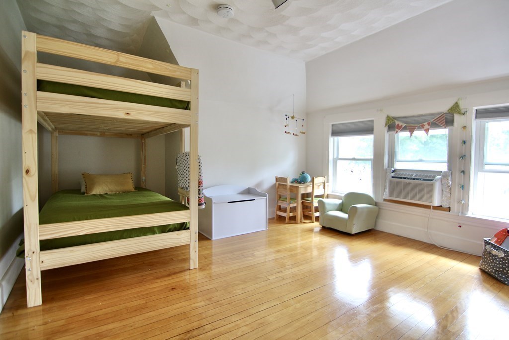 48-50 Townsend Road Belmont, MA 02478 - Photo 18 of 25 a living room with furniture floor to ceiling window and a wooden floor