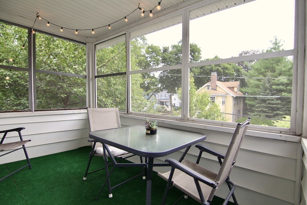 48-50 Townsend Road Belmont, MA 02478 - Photo 20 of 25 a view of a dining room with furniture window and outside view
