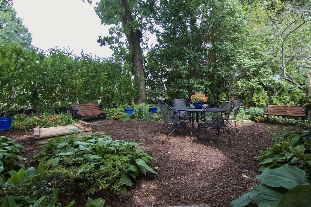 48-50 Townsend Road Belmont, MA 02478 - Photo 23 of 25 a backyard of a house with table and chairs