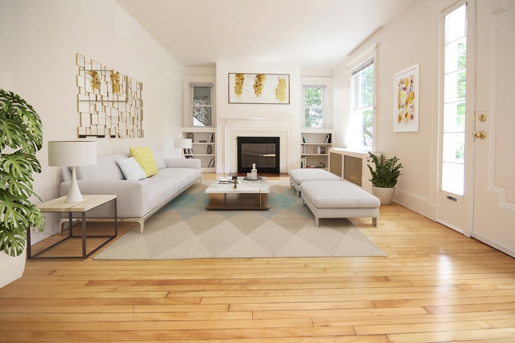 48-50 Townsend Road Belmont, MA 02478 - Photo 3 of 25 a living room with furniture and a fireplace