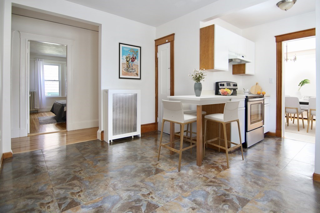 48-50 Townsend Road Belmont, MA 02478 - Photo 6 of 25 a dining room with furniture and wooden floor
