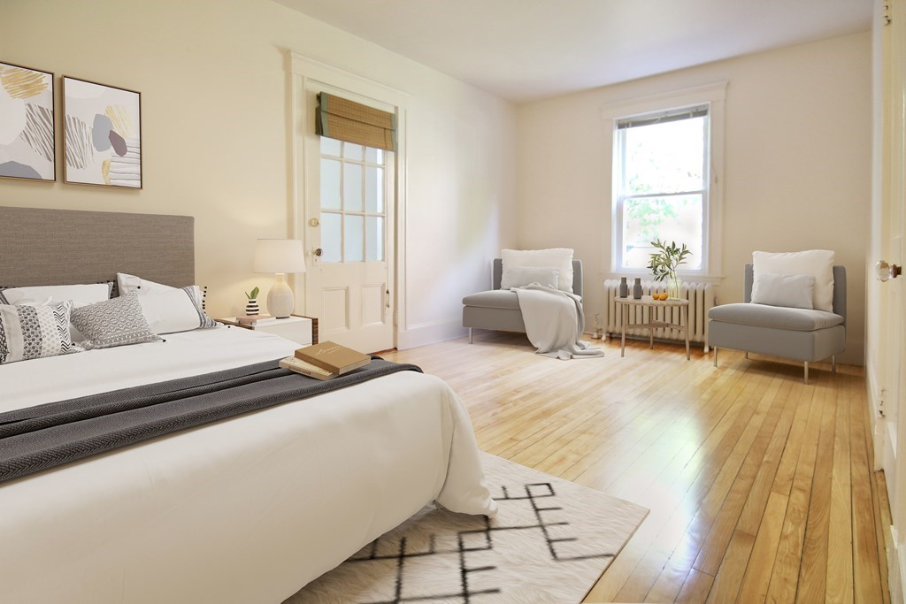 48-50 Townsend Road Belmont, MA 02478 - Photo 7 of 25 a bedroom with a bed and wooden floor