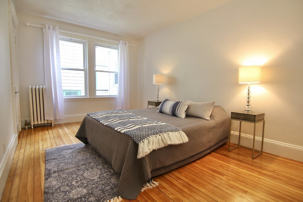 48-50 Townsend Road Belmont, MA 02478 - Photo 8 of 25 a spacious bedroom with a bed and wooden floor