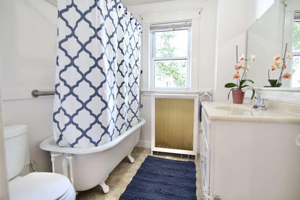 48-50 Townsend Road Belmont, MA 02478 - Photo 10 of 25 a bathroom with a sink toilet and a tub