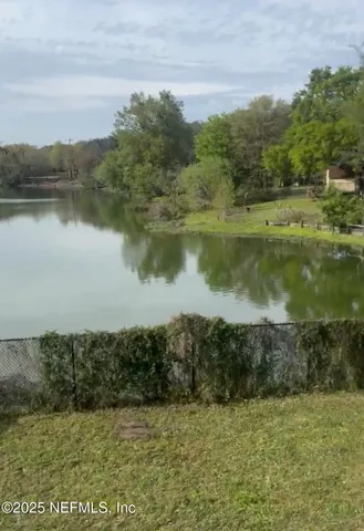 a view of a lake with a yard