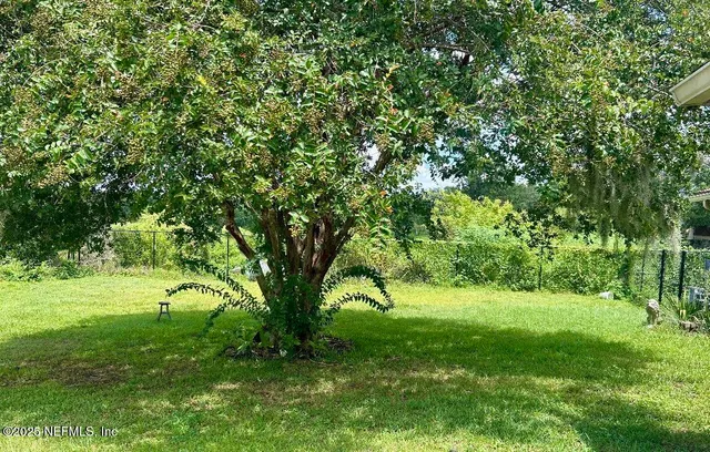a view of outdoor space with a yard
