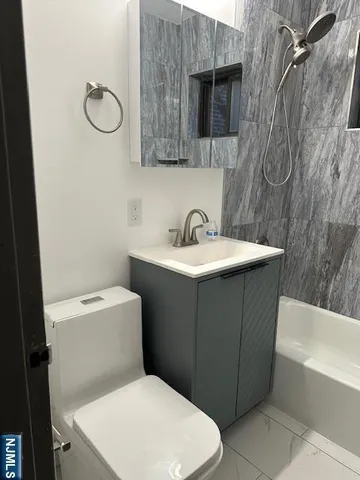 a view of a large building with large trees and plants