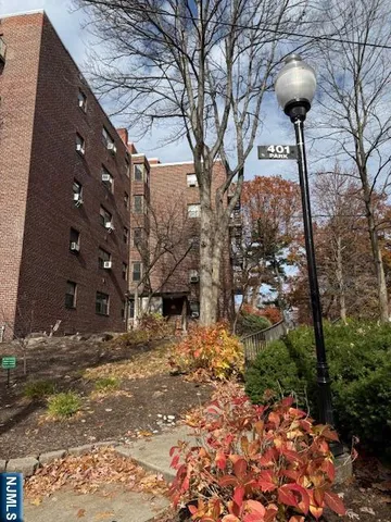 a view of house with outdoor space and sitting area