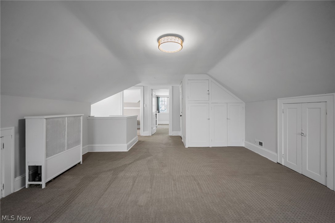 2924 Brighton Road Shaker Heights, OH 44120 - Photo 26 of 31 Bonus room featuring carpet, vaulted ceiling, and baseboards