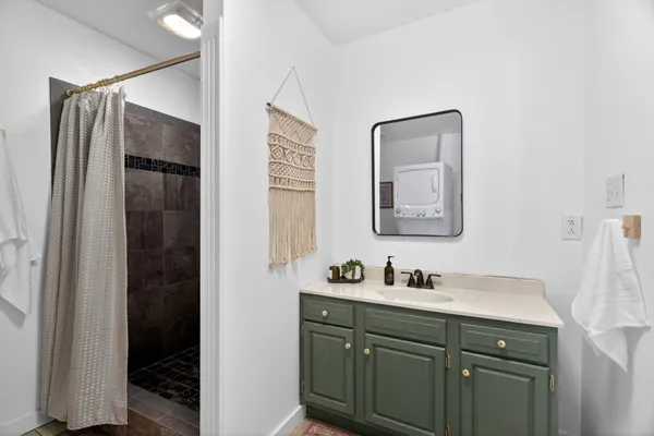 a bathroom with a double vanity sink and mirror