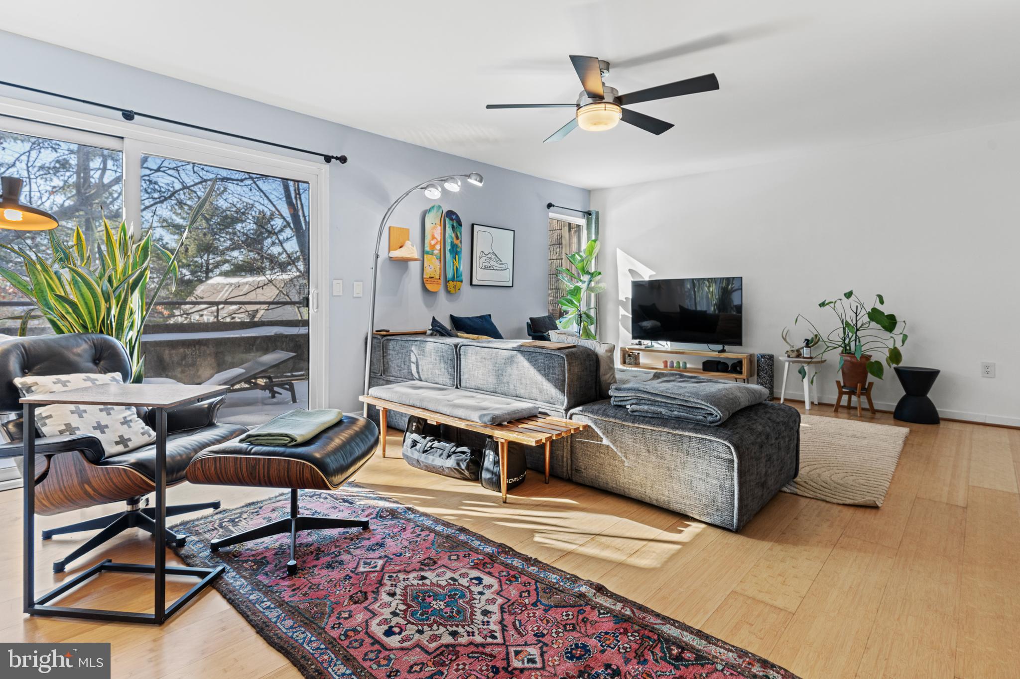 2361 Sundew Terrace, Unit 2361 Baltimore, MD 21209 - Photo 11 of 25 a living room with furniture a chandelier and a rug