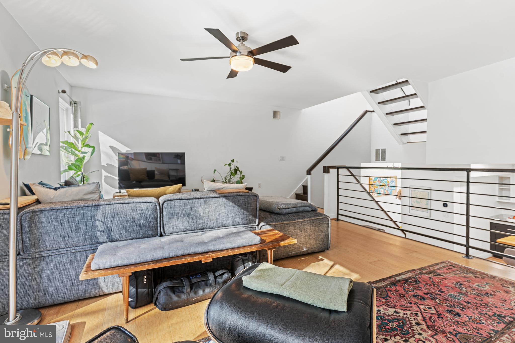 2361 Sundew Terrace, Unit 2361 Baltimore, MD 21209 - Photo 13 of 25 a living room with furniture and a flat screen tv