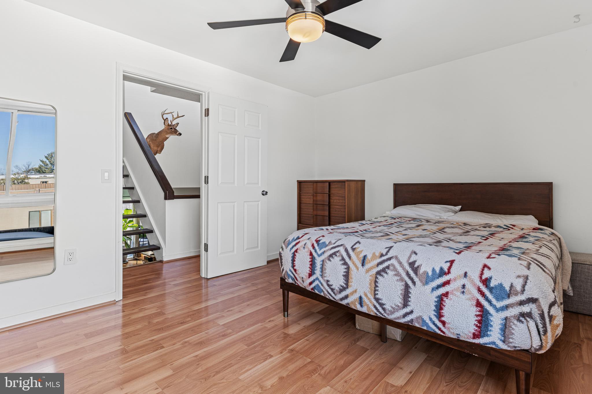 2361 Sundew Terrace, Unit 2361 Baltimore, MD 21209 - Photo 14 of 25 a bedroom with a bed and a chandelier