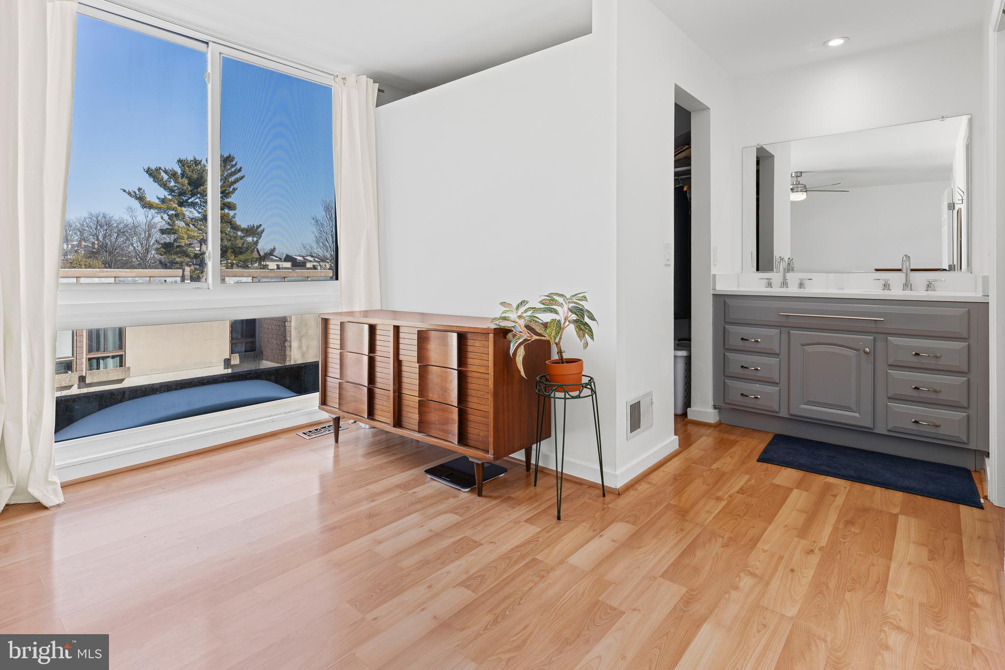 2361 Sundew Terrace, Unit 2361 Baltimore, MD 21209 - Photo 15 of 25 a spacious bedroom with a bed and a dresser