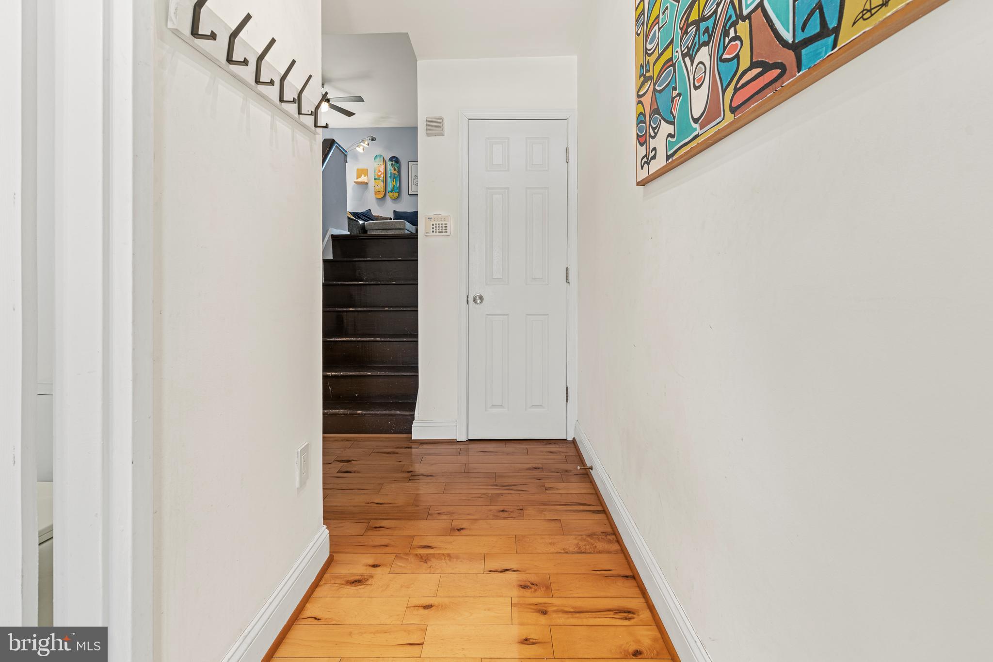 2361 Sundew Terrace, Unit 2361 Baltimore, MD 21209 - Photo 7 of 25 a view of a hallway with wooden floor and entryway