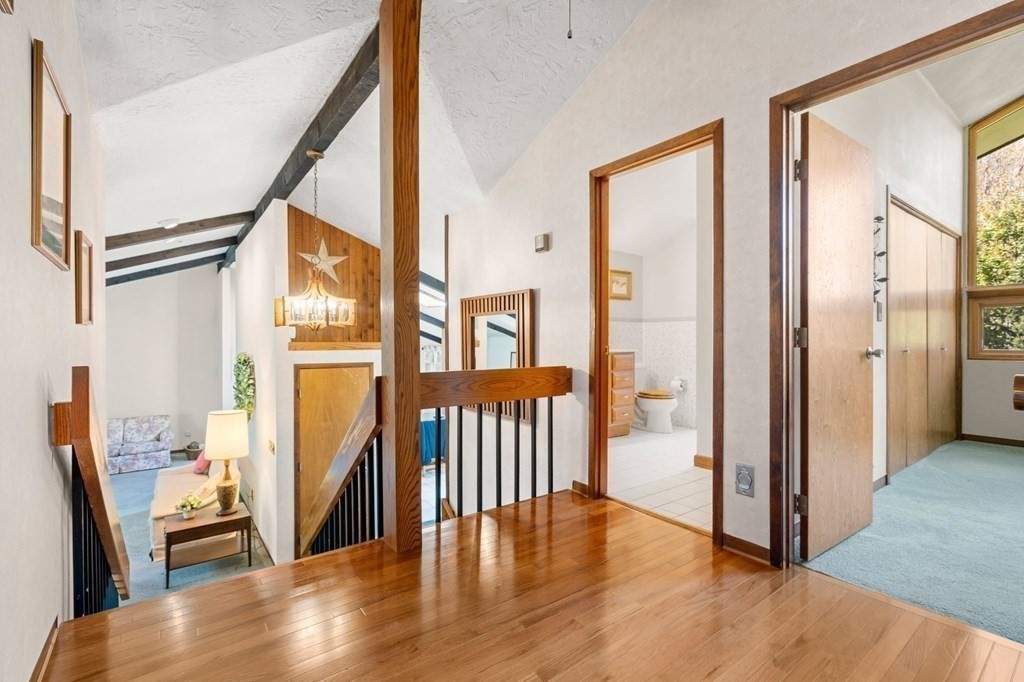 22 Maple Avenue Boxford, MA 01921 - Photo 12 of 42 a view of a hallway with wooden floor and windows