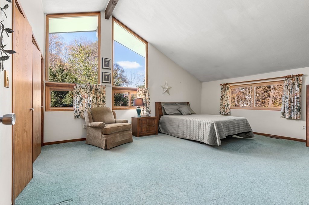 22 Maple Avenue Boxford, MA 01921 - Photo 17 of 42 a bedroom with a large bed couch and a window