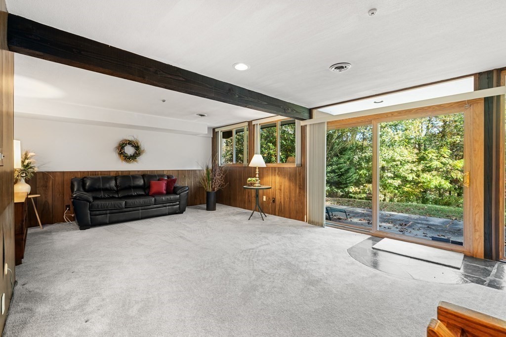 22 Maple Avenue Boxford, MA 01921 - Photo 24 of 42 a room with furniture and a flat screen tv