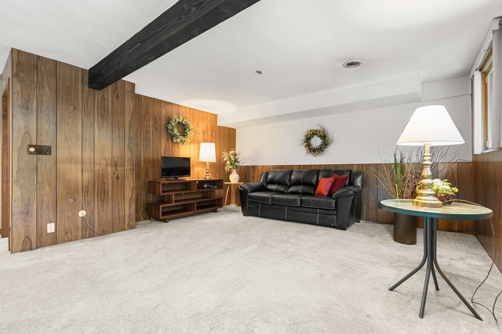 22 Maple Avenue Boxford, MA 01921 - Photo 25 of 42 a living room with furniture and a flat screen tv