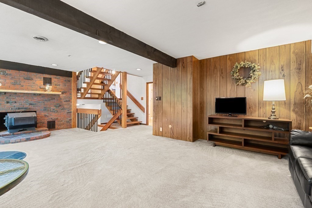22 Maple Avenue Boxford, MA 01921 - Photo 26 of 42 a view of a livingroom with furniture and a flat screen tv