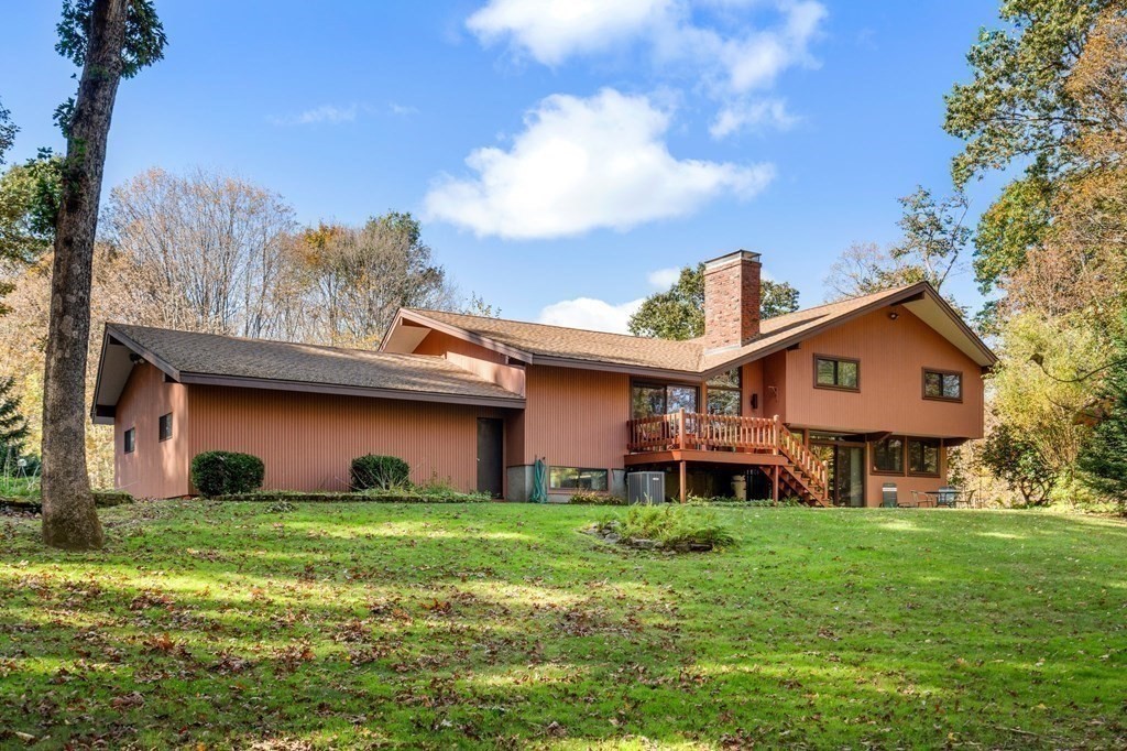 22 Maple Avenue Boxford, MA 01921 - Photo 37 of 42 a front view of a house with garden